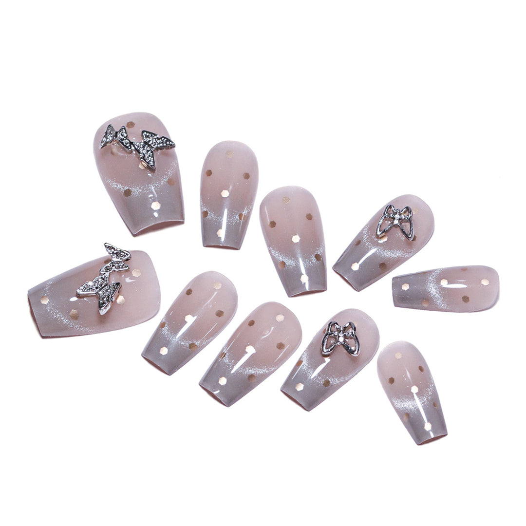Artificial nail art with glitter details and bow accents Kalsten