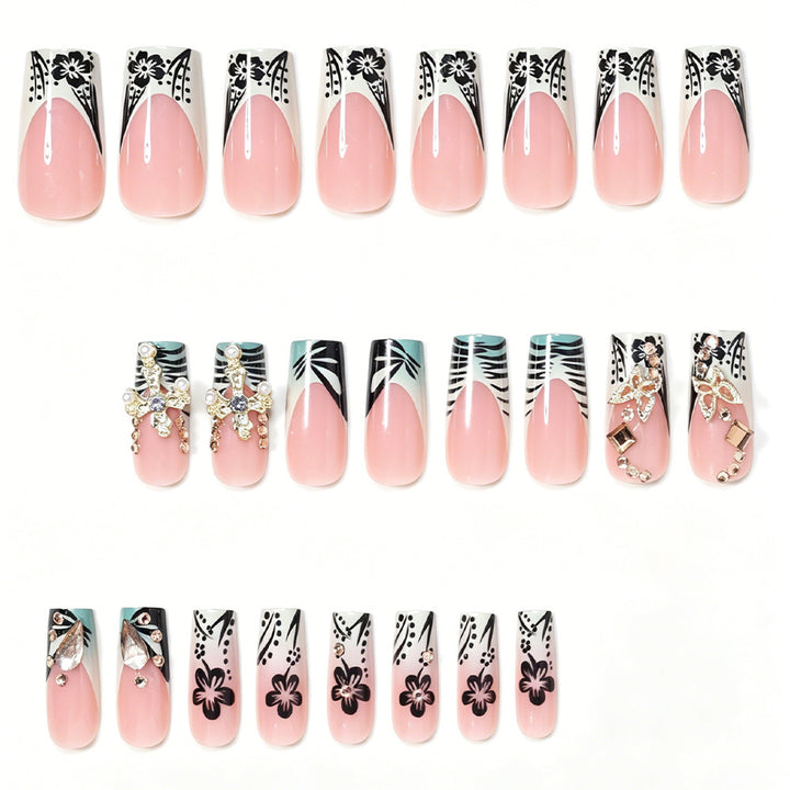 Artistic Stiletto Nail Design with Floral Accents and Gems Kalsten