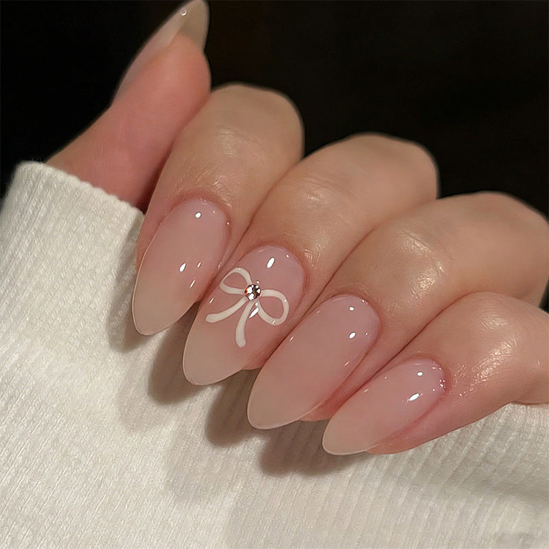 Artificia nails with delicate bow accents Kalsten