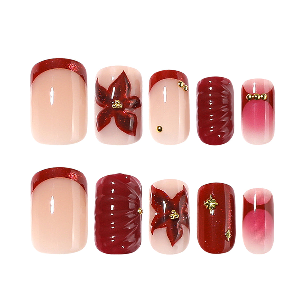 Artful nail design with floral and golden accents Kalsten