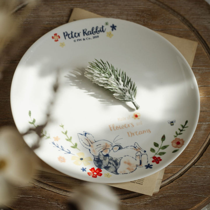 Children's plate made of porcelain with rabbit illustration and floral decoration
