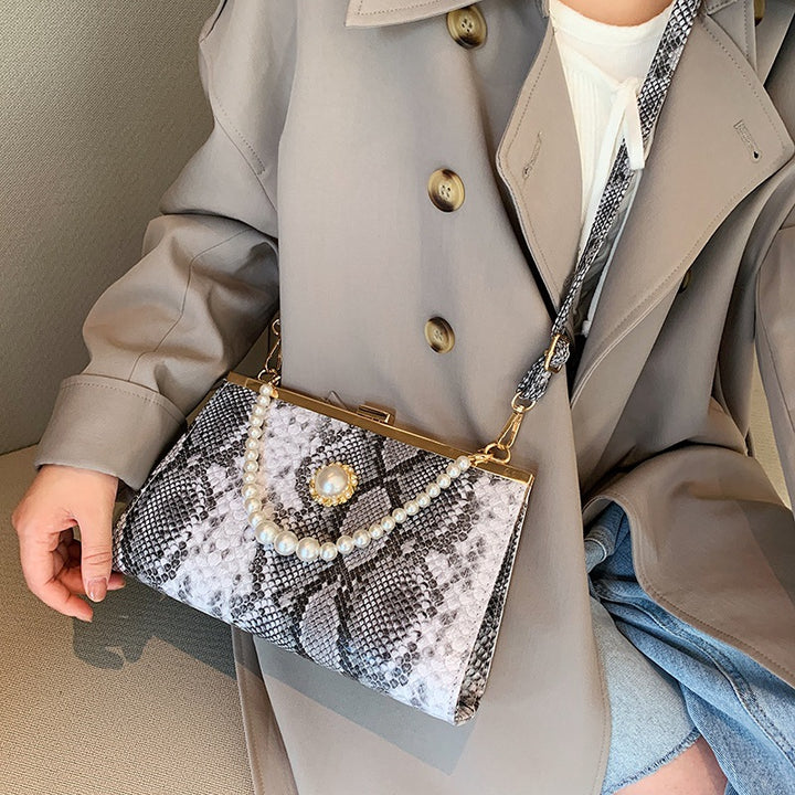 Elegant Pearl-Embellished Snakeskin Clutch Bag