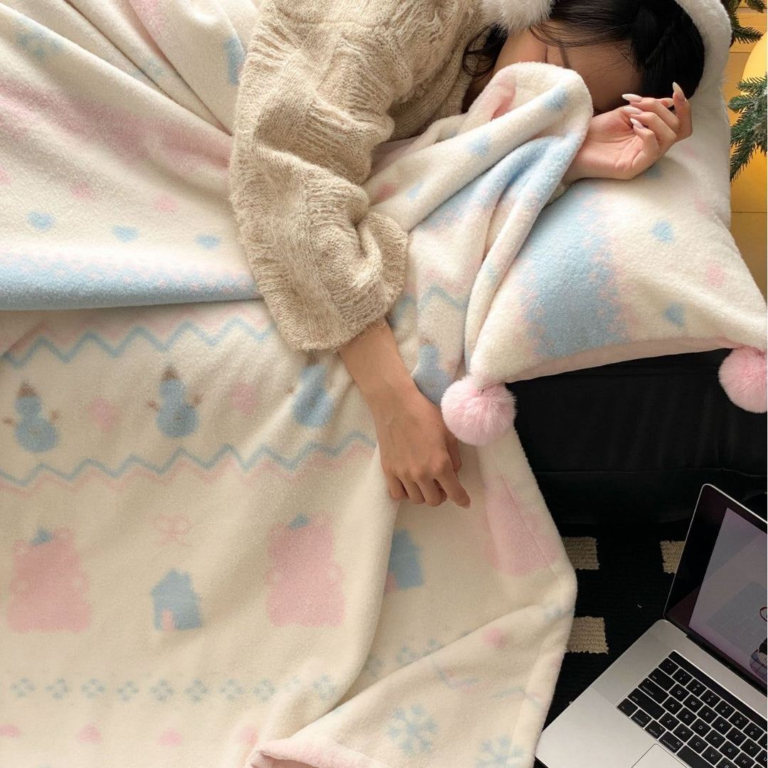 Soft blanket made of microfleece with pompom and Nordic bear pattern