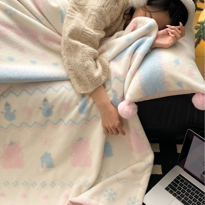 Soft blanket made of microfleece with pompom and Nordic bear pattern