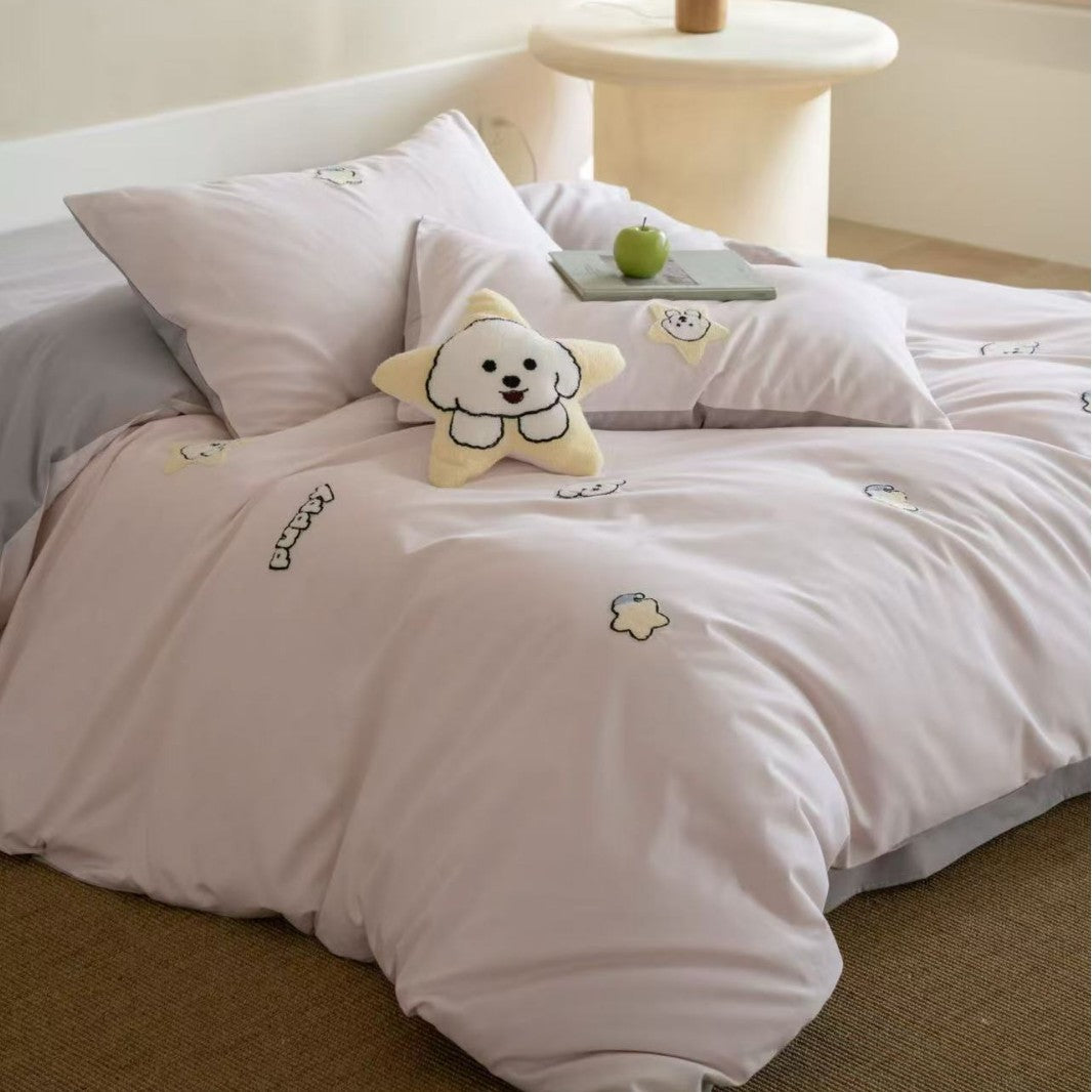 Children's bedding set with embroidered penguin appliqués and plush cuddle details