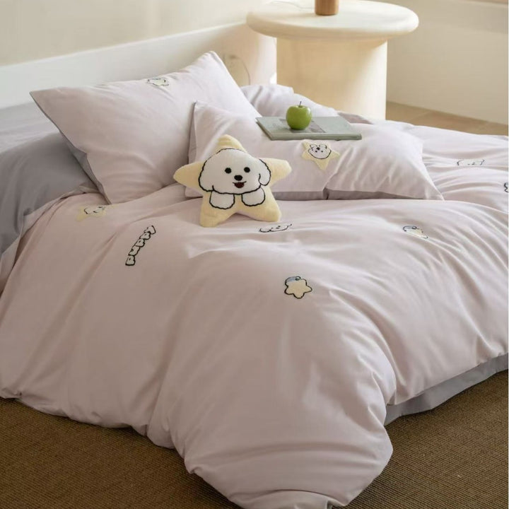 Children's bedding set with embroidered penguin appliqués and plush cuddle details