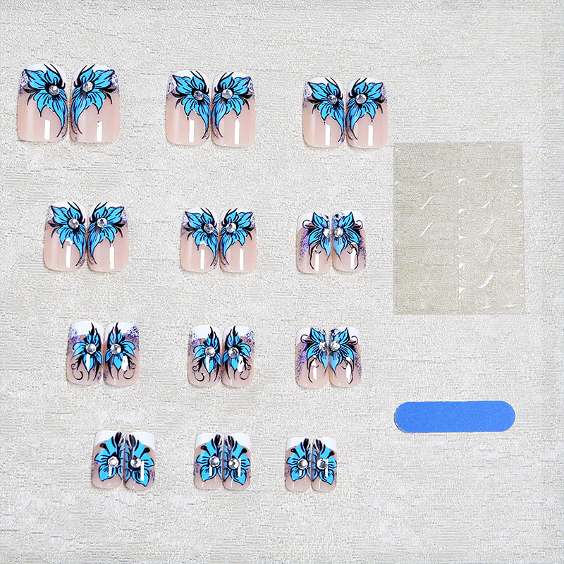 Artificial nail set with intricate floral designs and glitter elements Kalsten