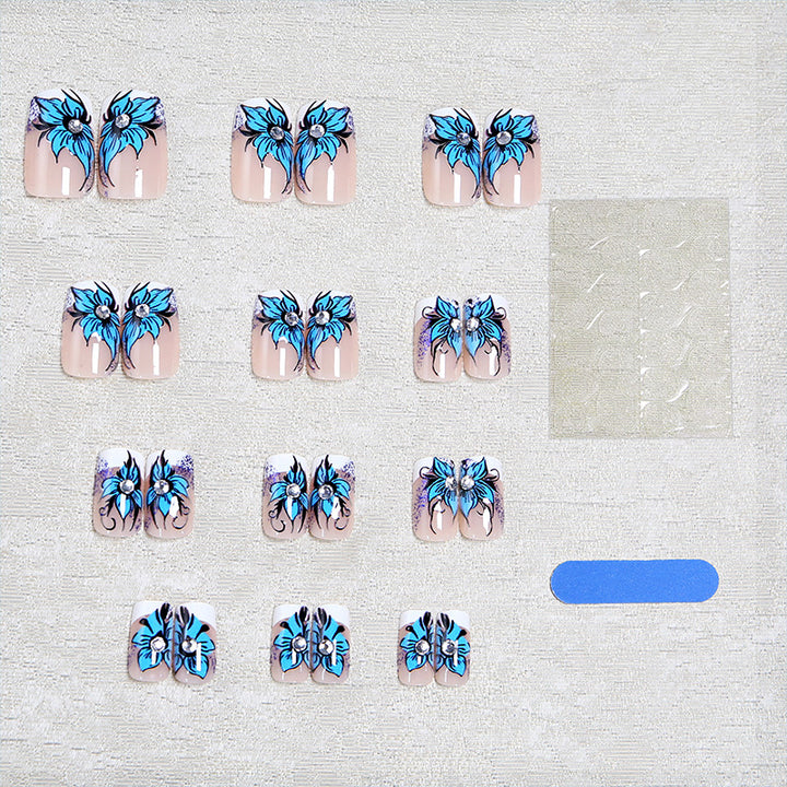 Artificial nail set with intricate floral designs and glitter elements Kalsten