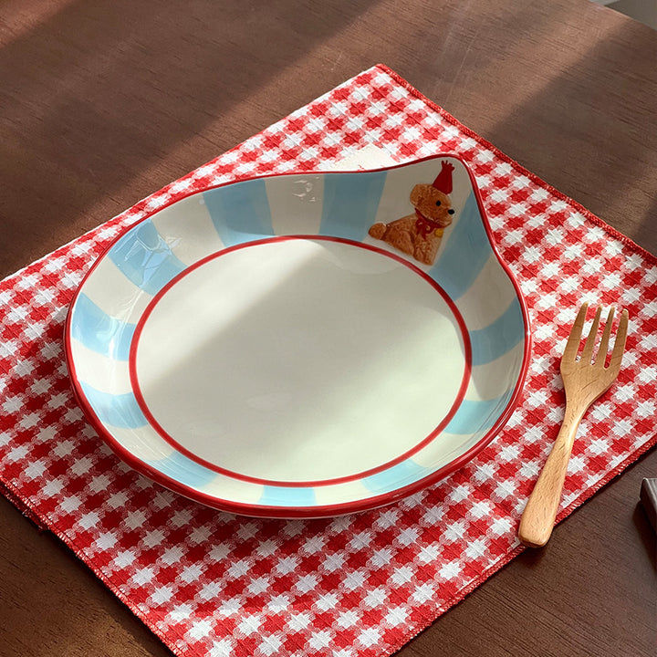 Decorative ceramic deep plate with pouring spout, striped rim and bear motif