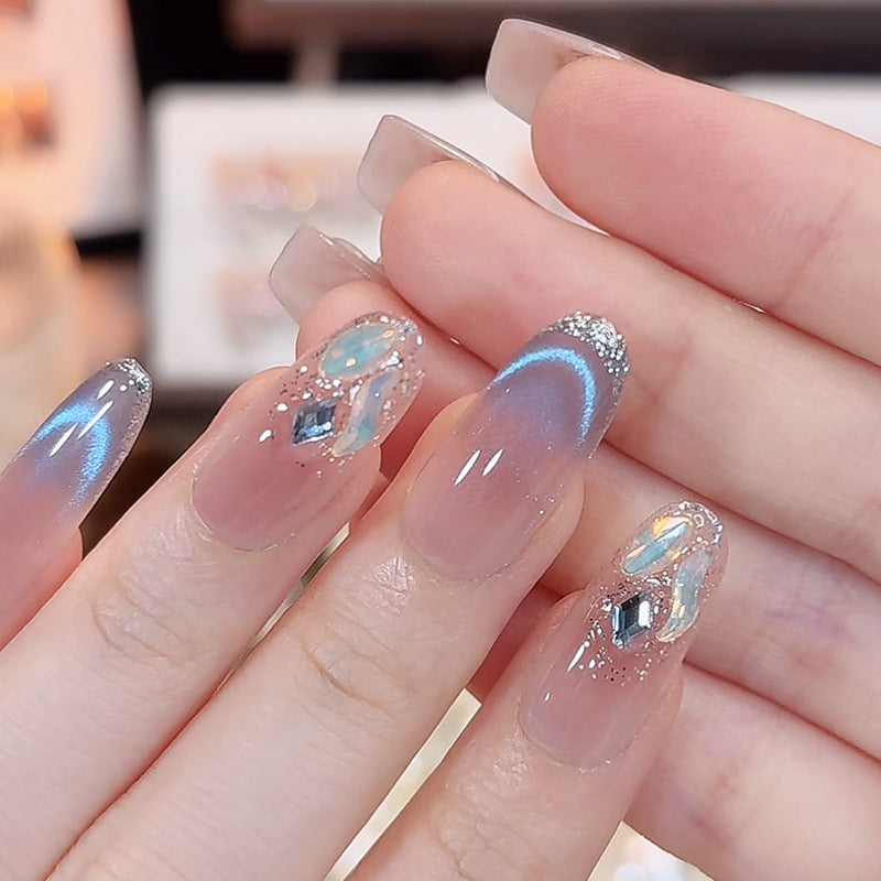Artificial nail set with festive gift design and elegant glitter accents Kalsten