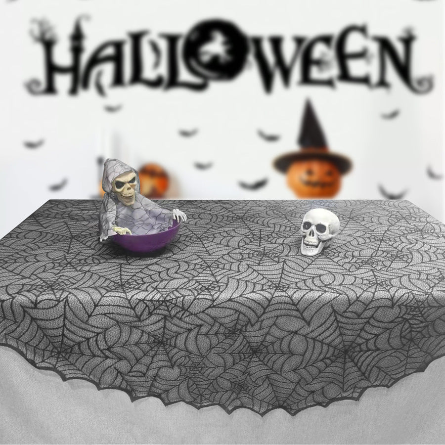 Transparent lace table cover with spider web design for Halloween decor