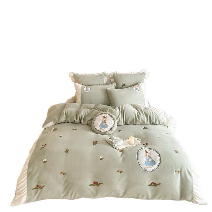 Quilted children's bedding set with embroidered bunny appliqués and ruffles