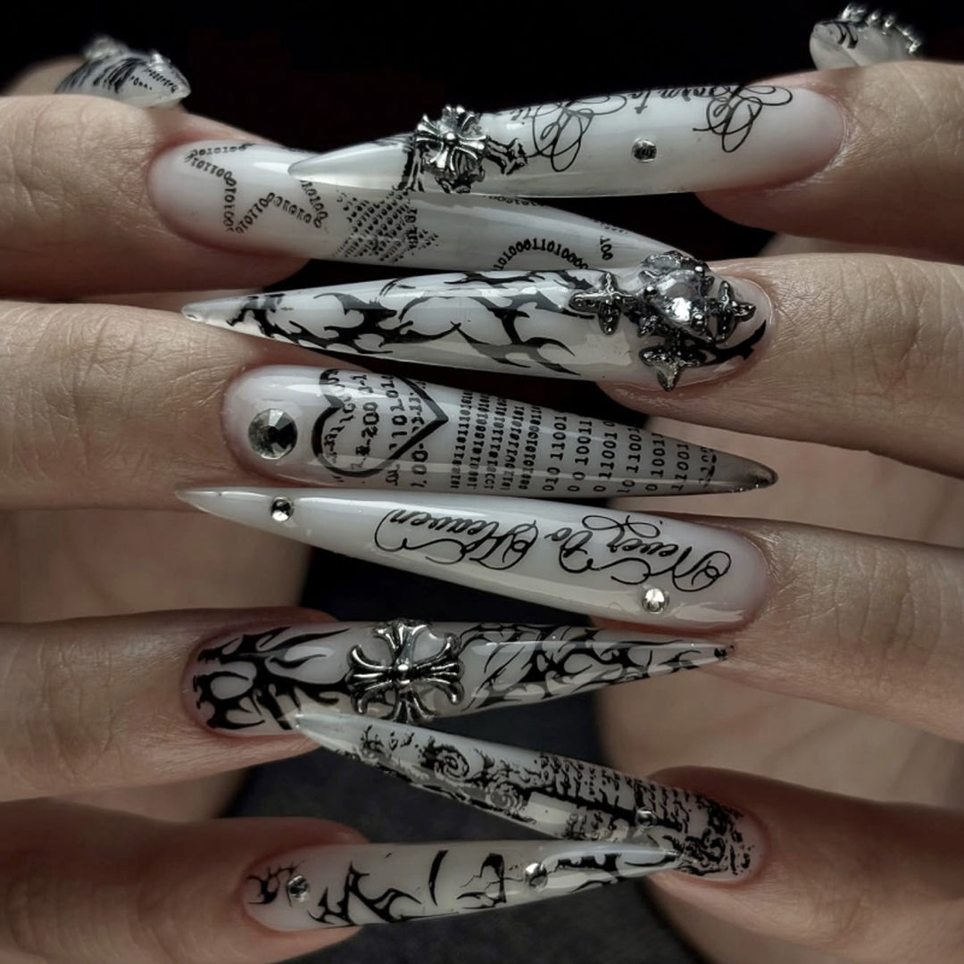 Artful stiletto nails with gothic pattern and embellishments Kalsten