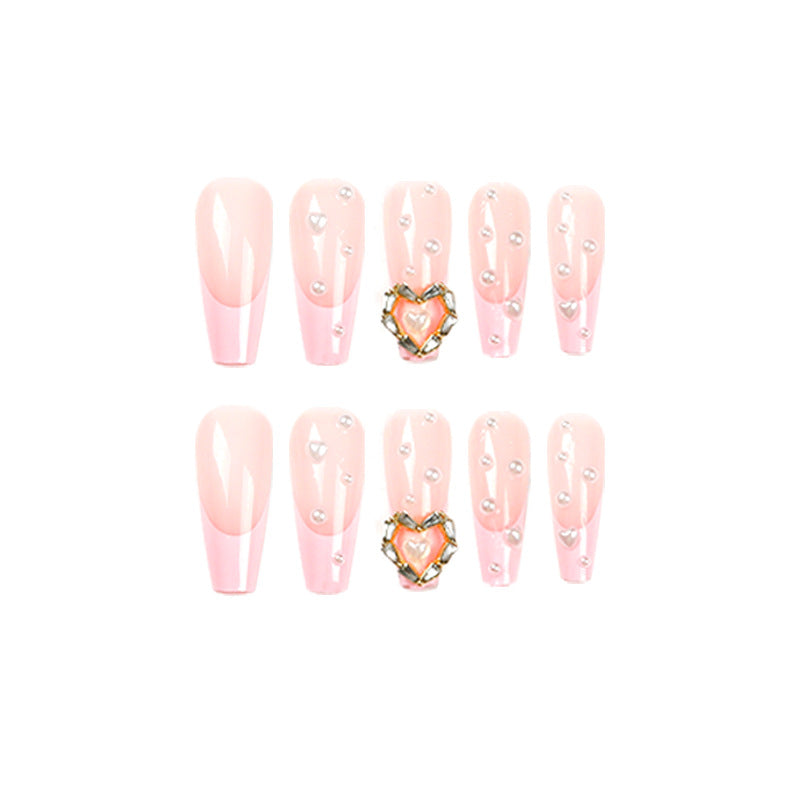 Artistic nail art with heart and pearl accents Kalsten