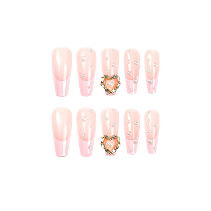 Artistic nail art with heart and pearl accents Kalsten