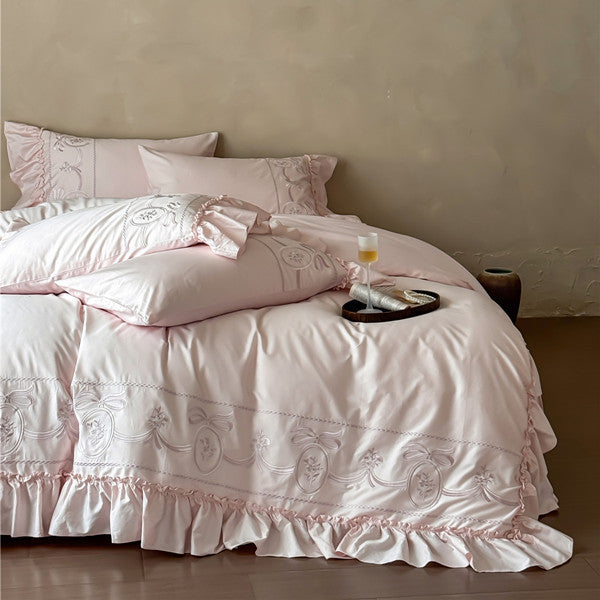 Luxurious embroidered bedding set with ruffle and pillowcases