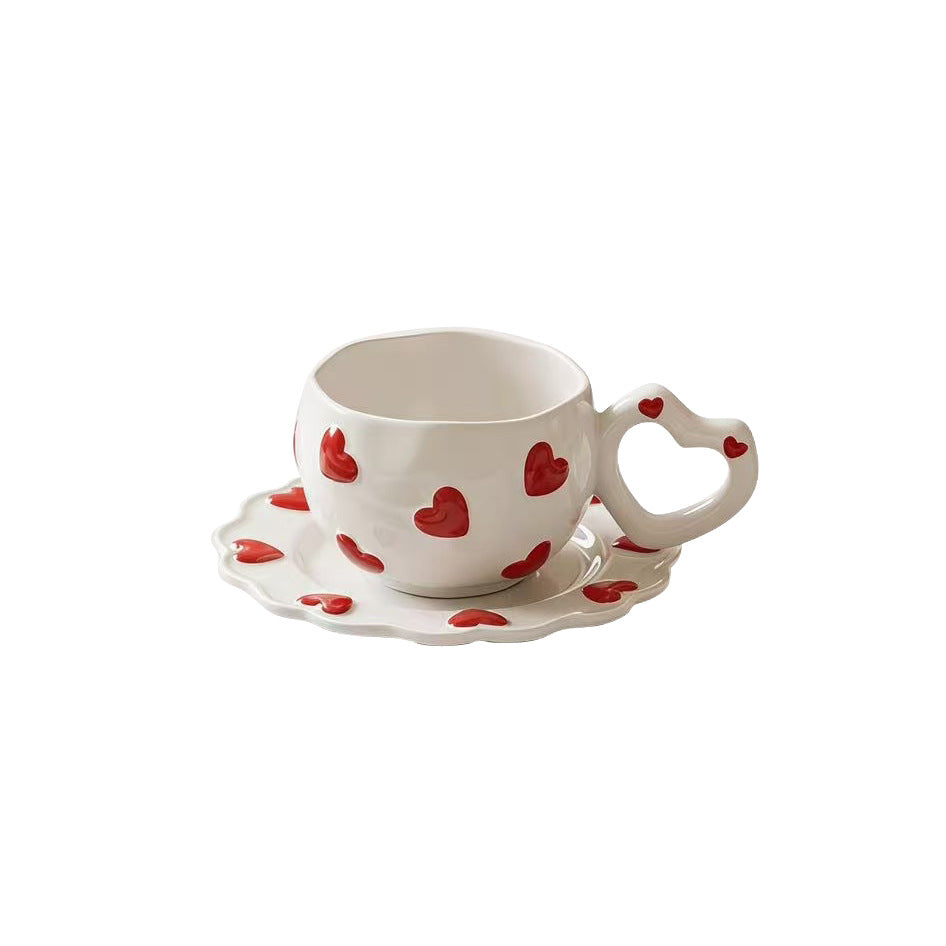 Porcelain cup set with heart-shaped handle and embossed decorative hearts