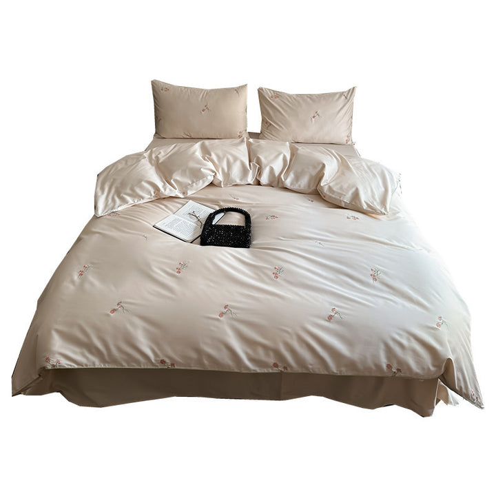 Luxurious cotton satin bedding set with delicate floral embroidery and a silky-matte surface