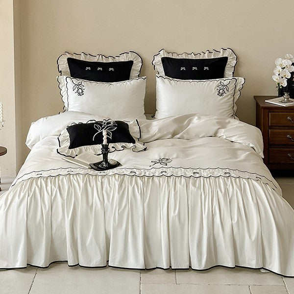 Elegant cotton satin bedding set with contrasting edge embroidery and frill
