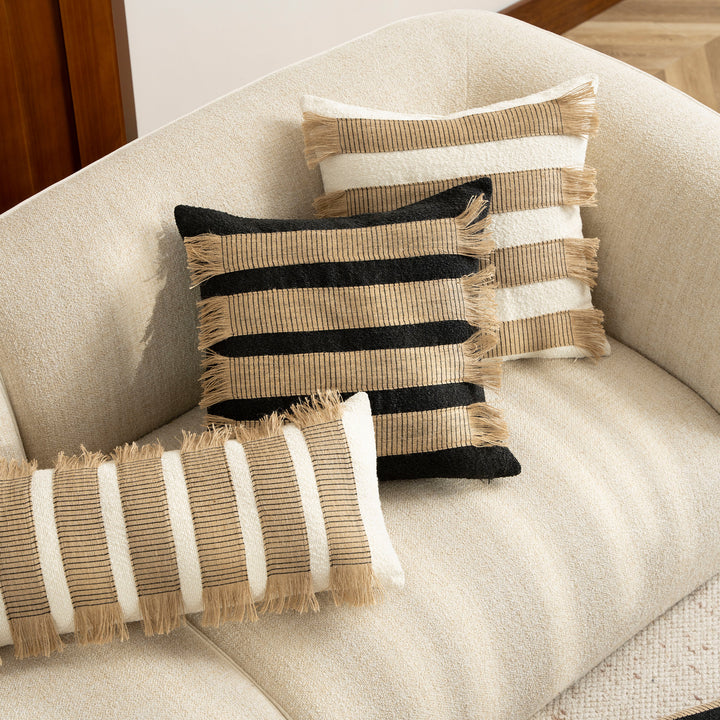 Woven cushion cover with bouclé surface and jute fringes Kalsten