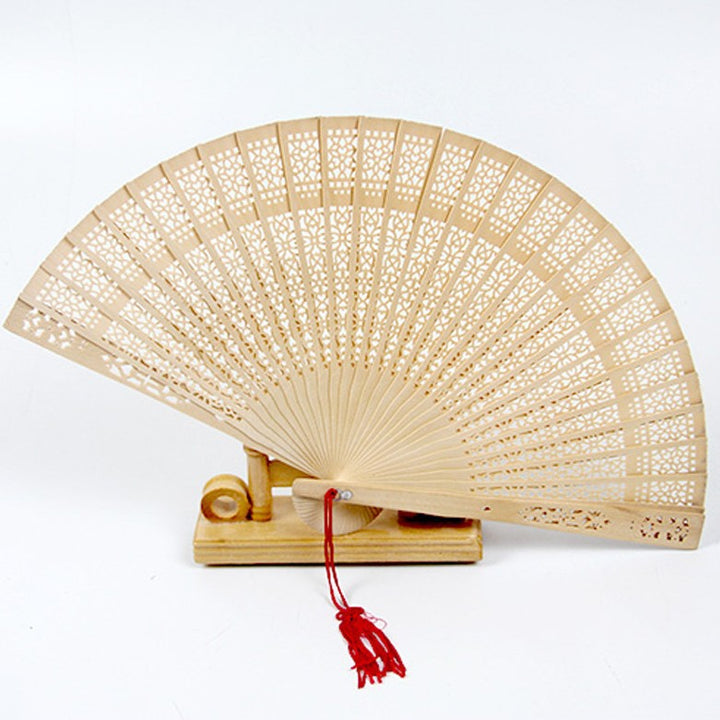 Ladies fan made of delicate plastic with artistic cut pattern Kalsten