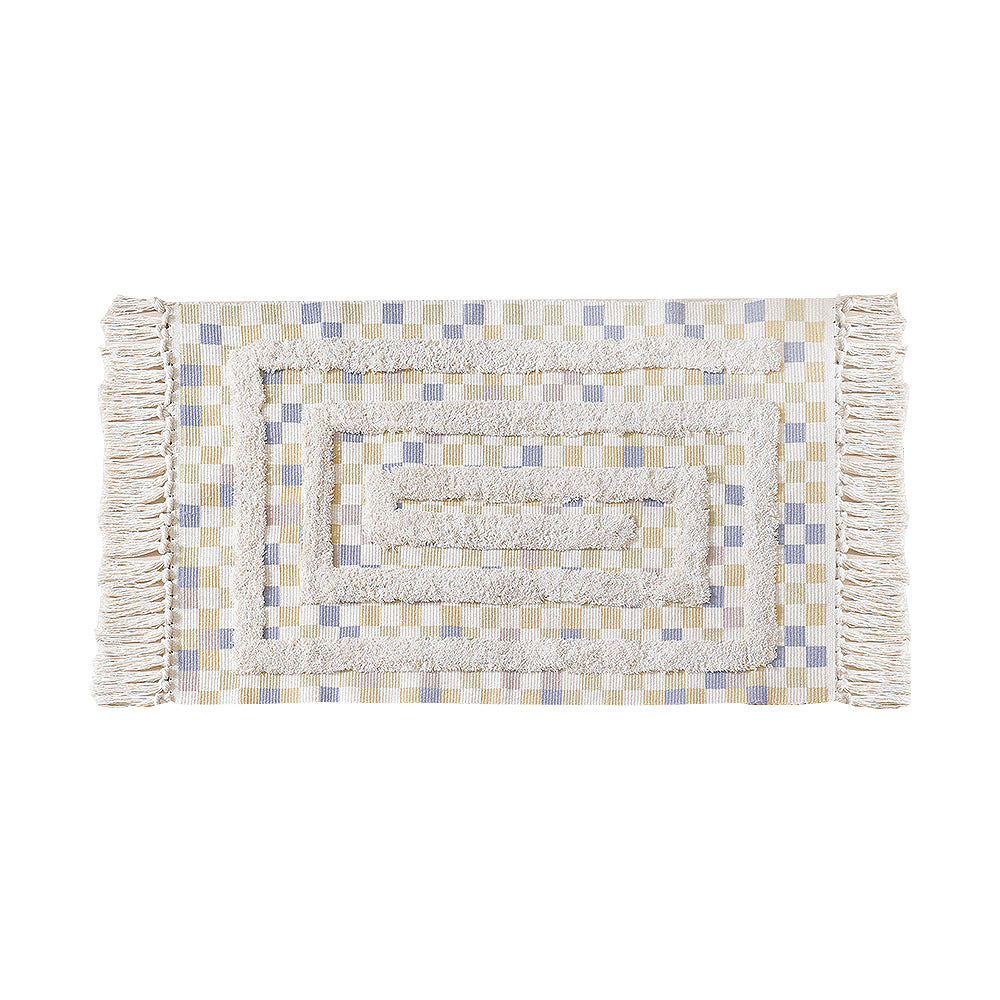 Handwoven cotton runner with pompom tufting and decorative fringes