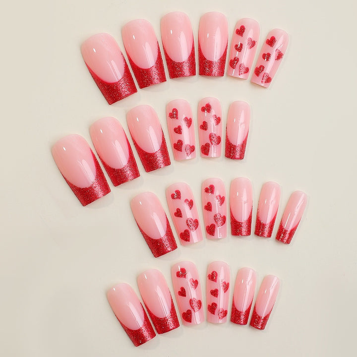 Artificial nail set with romantic heart designs and glitter accents Kalsten