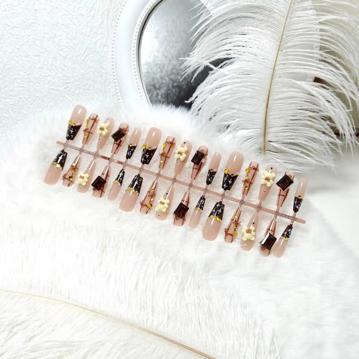 Artificial nails with playful animal designs and glitter effects Kalsten