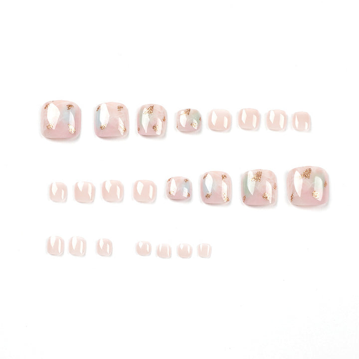 Artful toenail art with elegant marble and gold accents Kalsten