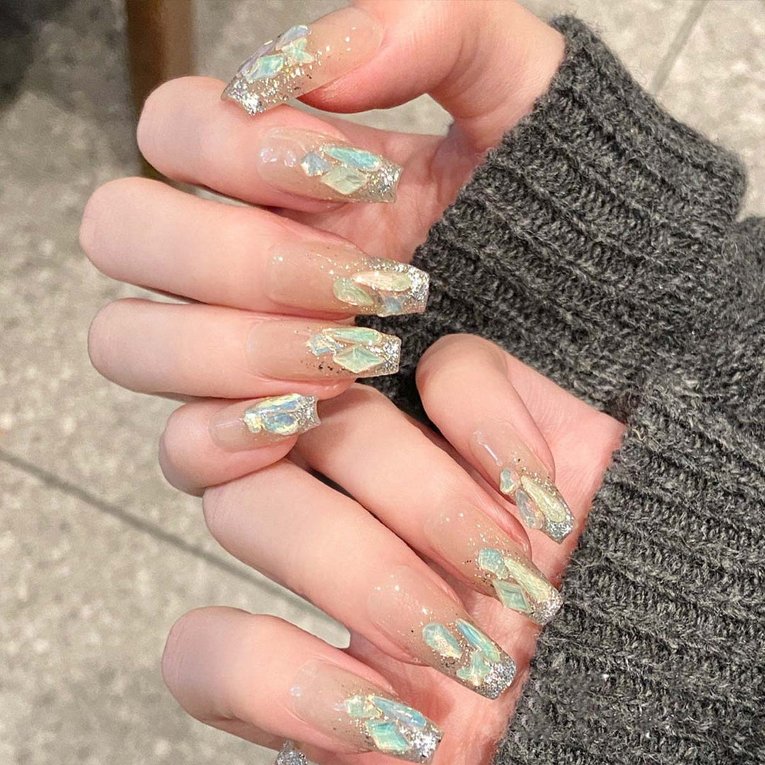 Glamorous nail tips with glitter accents Kalsten