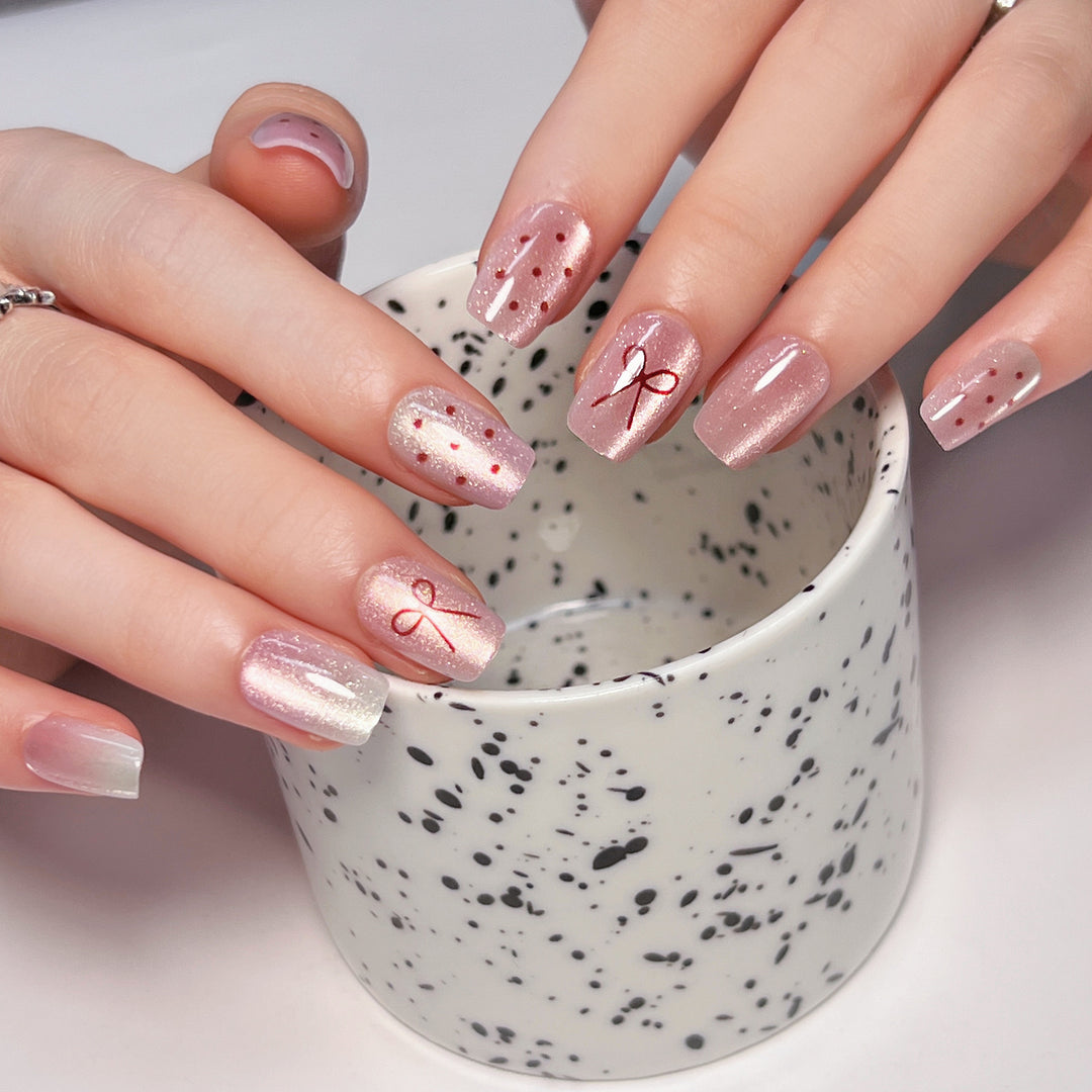 Artificial nail art with cute bow design Kalsten