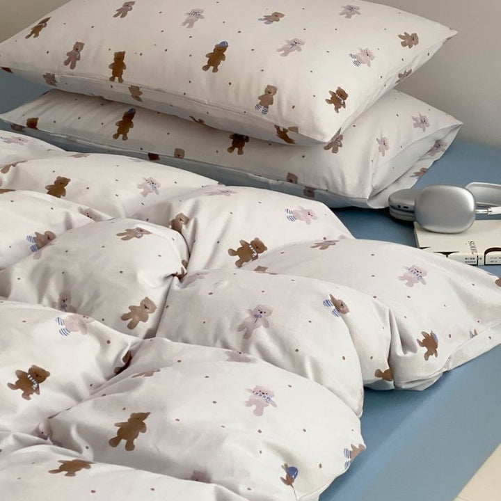 Light cotton bedding set with quilted topper and fine stripe pattern