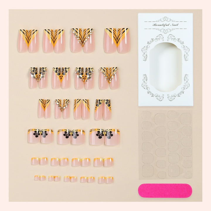 Artificial nail art with extravagant designs and glitter elements Kalsten
