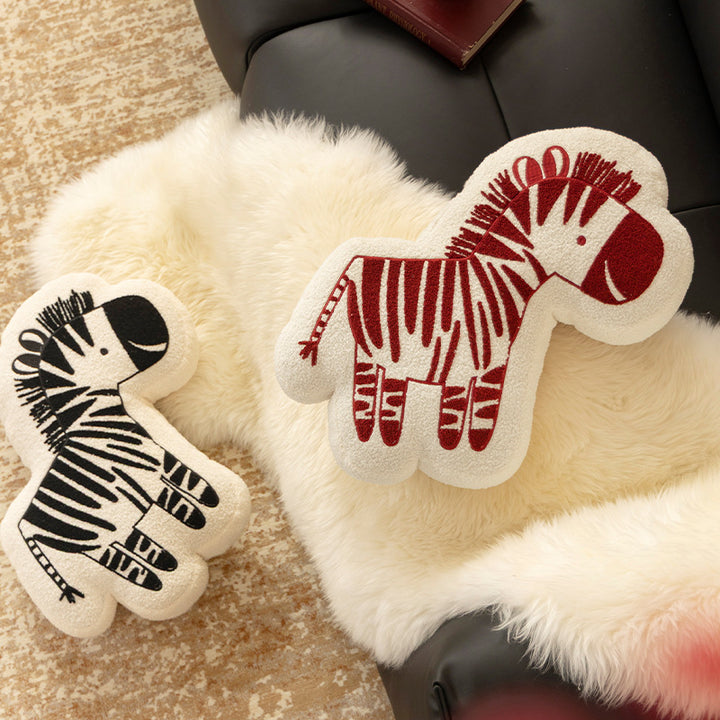 Shaped children's room decorative pillow made of teddy fleece with embroidered zebra motif and contoured silhouette