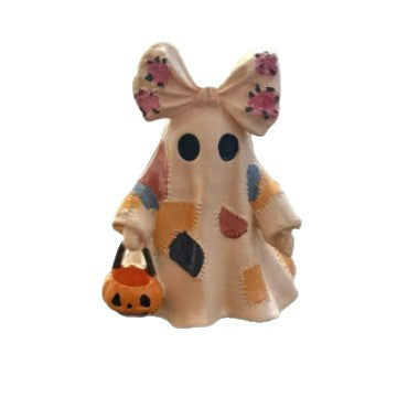 Ceramic ghost figure with integrated lighting and pumpkin basket