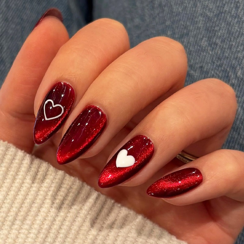 Glamorous artificial nail set with glitter effects and elegant bow motifs Kalsten