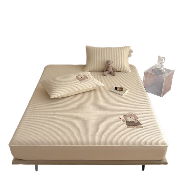 Quilted mattress topper with bunny applique and non-slip bottom