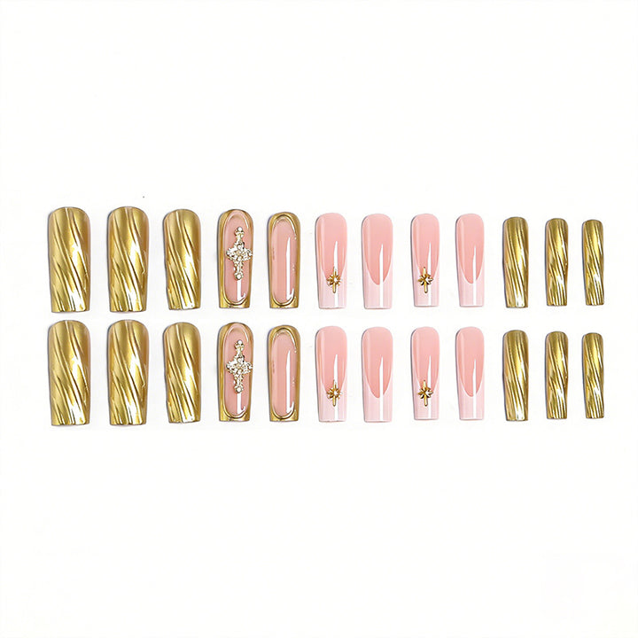 Acrylic nail set with elegant golden embellishments and glamorous accents Kalsten