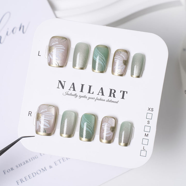 Artistic Press-On Nail Design with Floral and Glitter Accents Kalsten