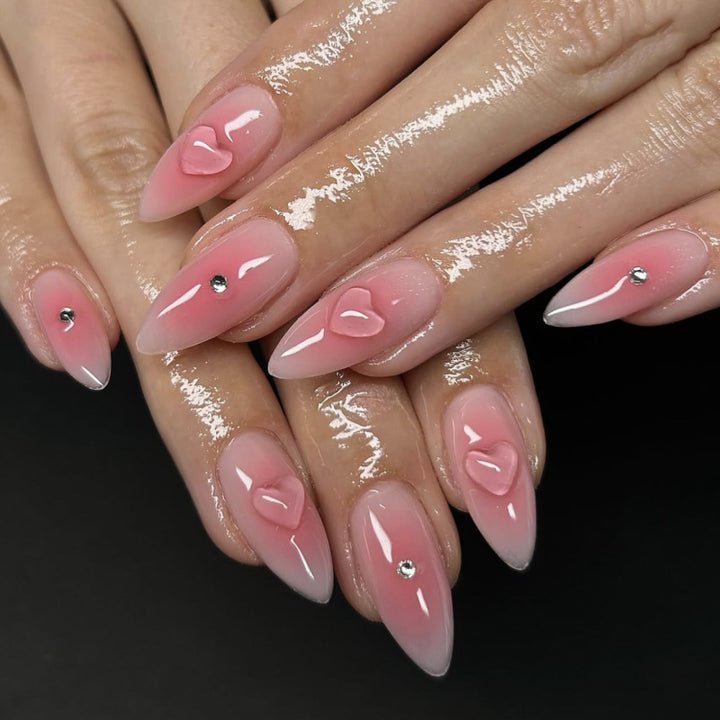 Artful stiletto nails with heart design and glitter accents Kalsten