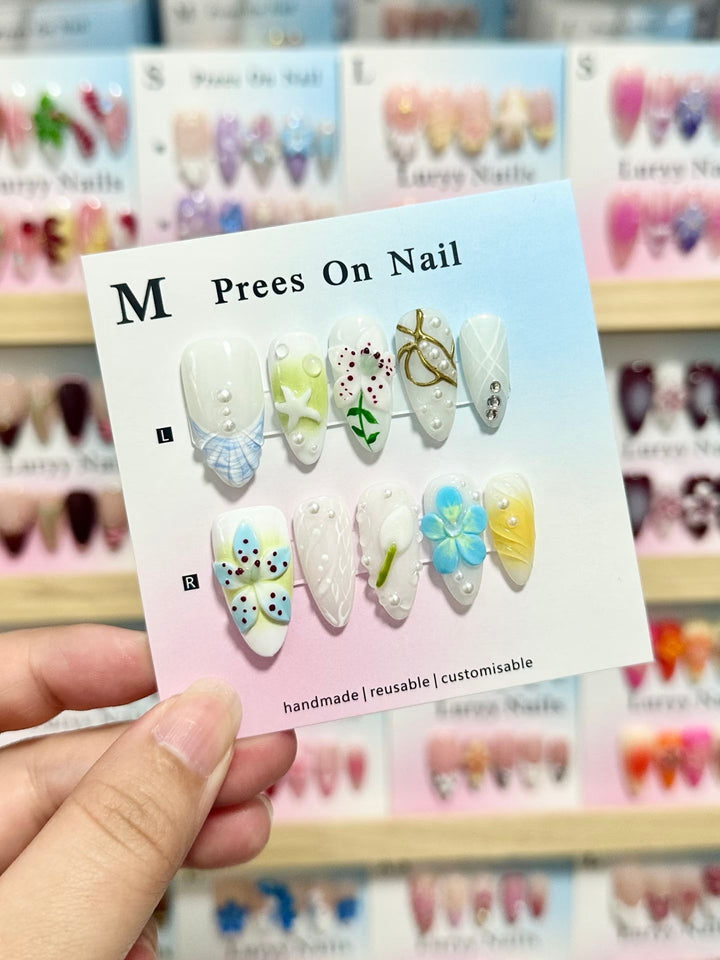 Artistic Press-On Nail Set with Floral and Green Accents
