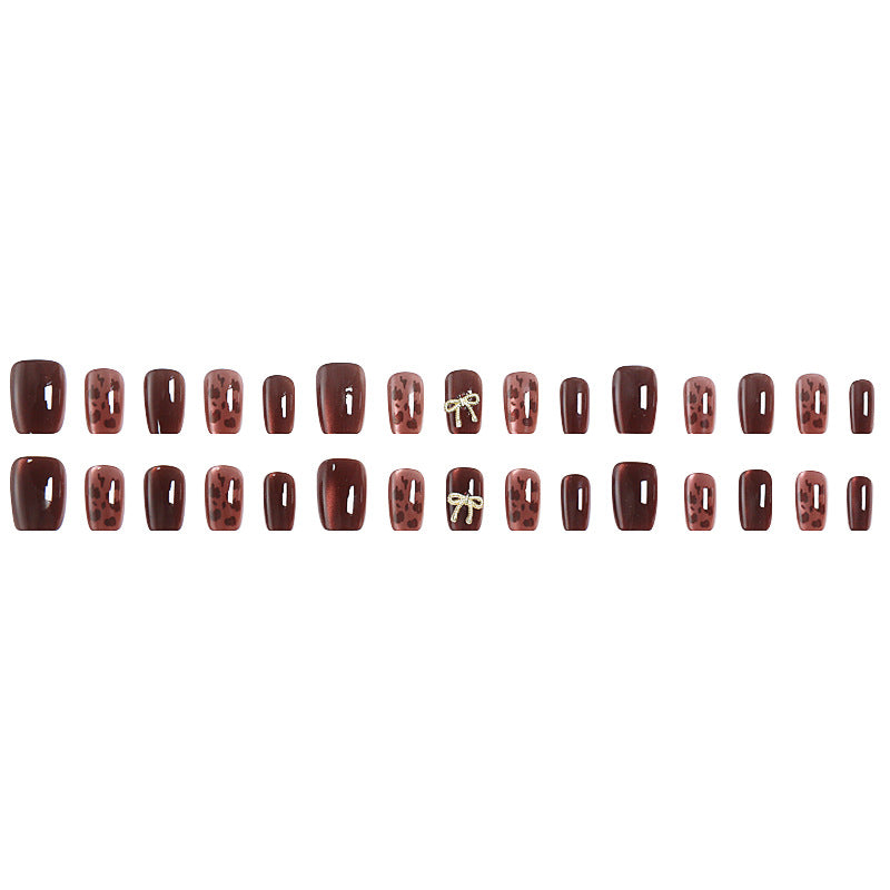 Nail set with elegant leopard pattern and luxurious accents Kalsten