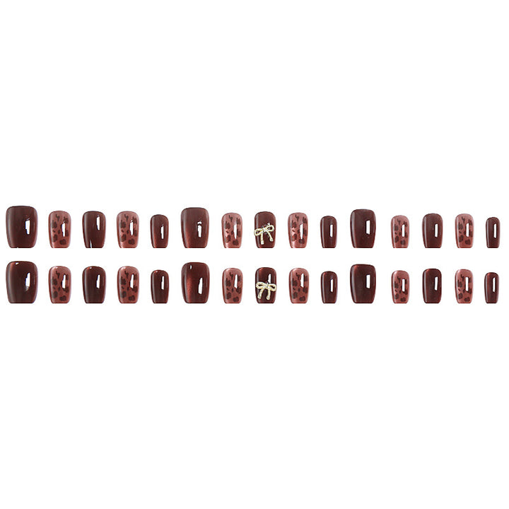 Nail set with elegant leopard pattern and luxurious accents Kalsten