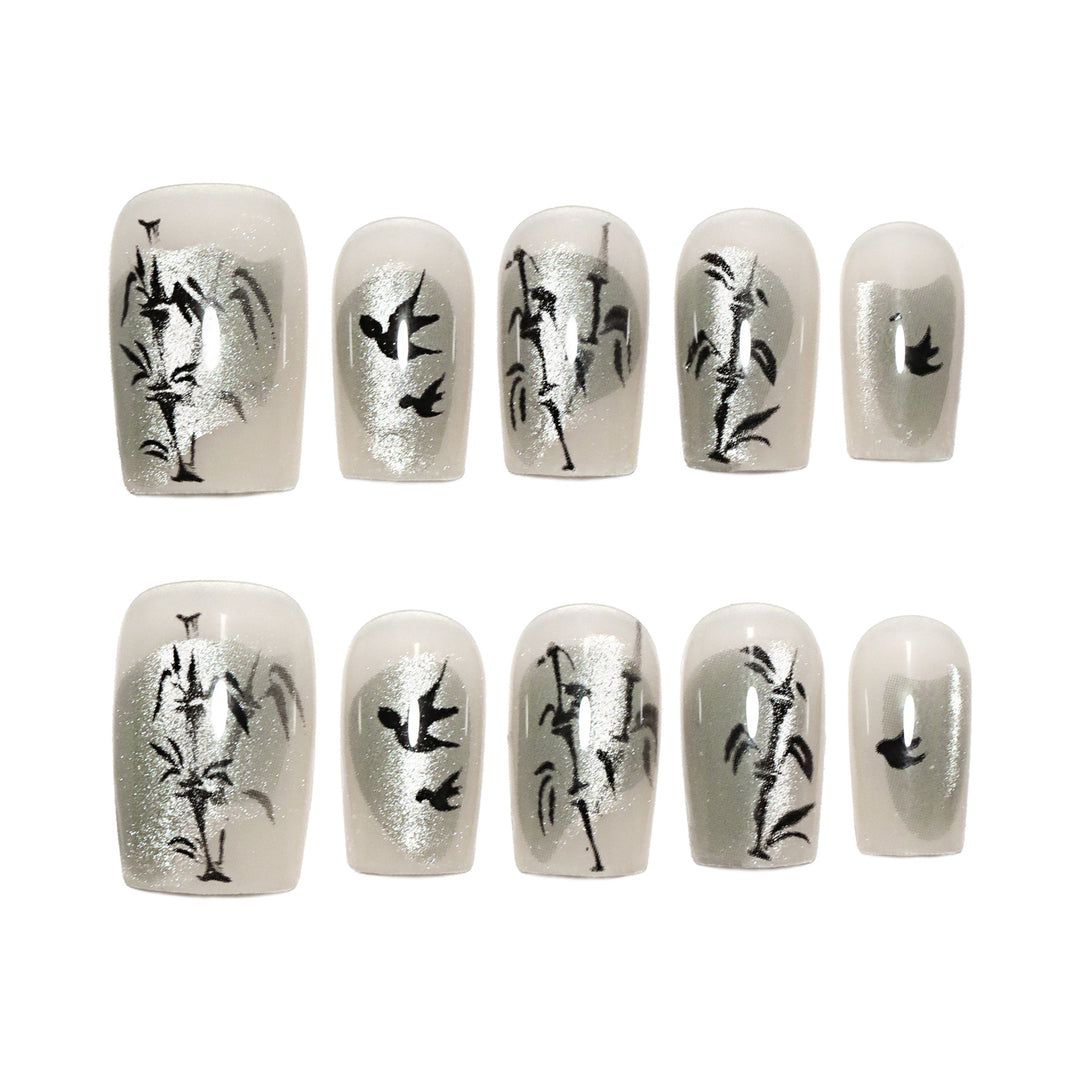 Handcrafted acrylic nails with decorative bird motifs Kalsten