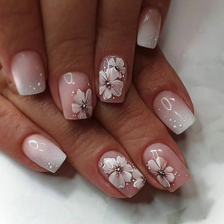 Artistic gel nails with floral decorations Kalsten