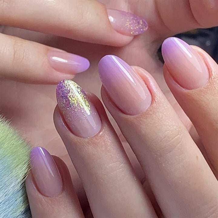 Artful nail art with ombre design and glitter accents Kalsten