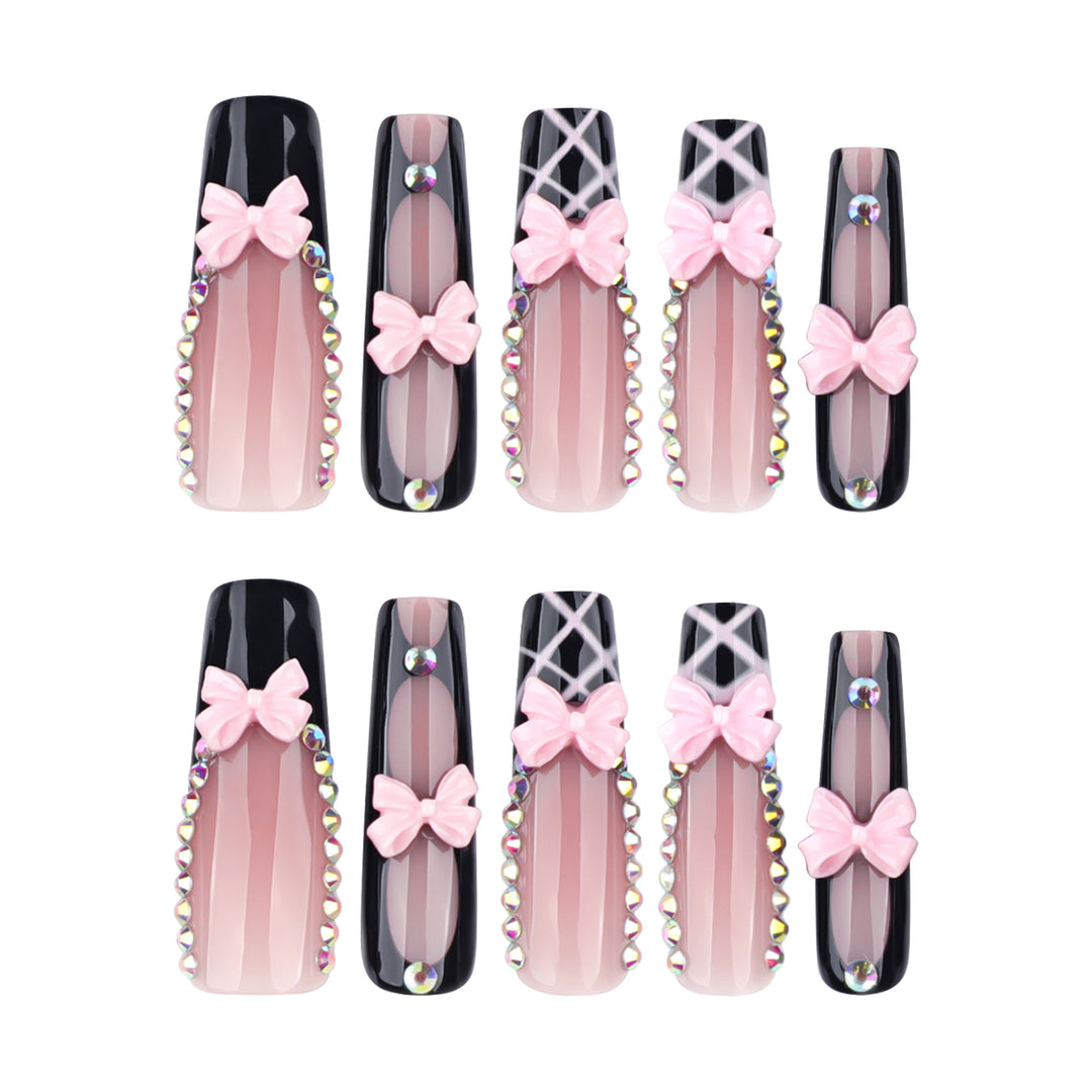 Artistic acrylic nails with floral design and rhinestone bow Kalsten
