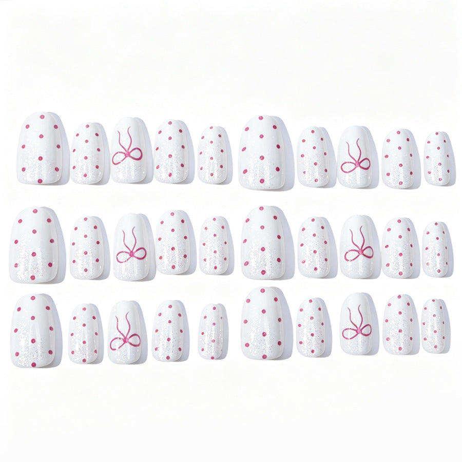 Artificial nail set with delicate dots and bow pattern Kalsten