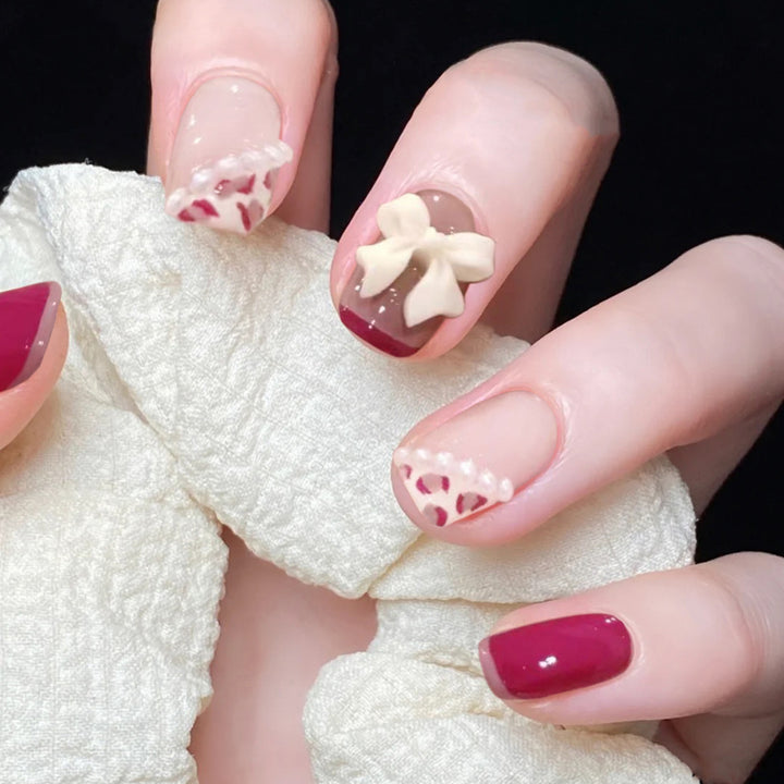 Artful nail art with elegant bow design Kalsten