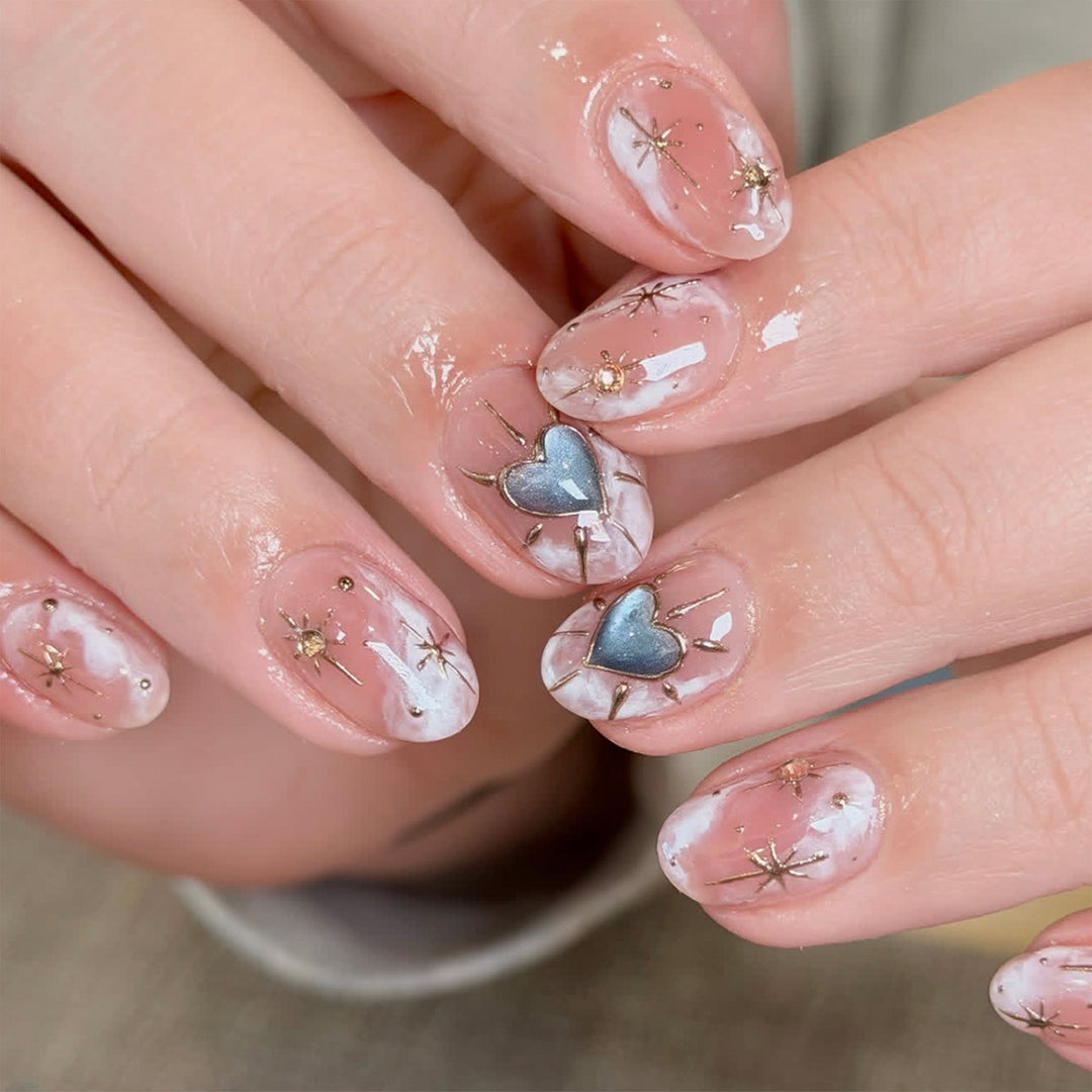 Nail design with decorative hearts and glitter accents Kalsten
